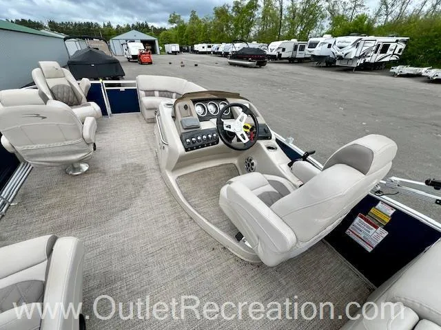 Slide: The Image of 2017 Bennington 23 RSR pontoon boat interior with plush seating and modern dashboard. - 16