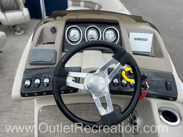 Slide: The Image of 2017 Bennington 23 RSR boat dashboard with steering wheel and control panel. - 17