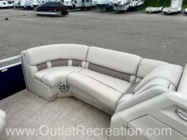 Slide: The Image of 2017 Bennington 23 RSR pontoon boat interior with plush seating and speaker system. - 21