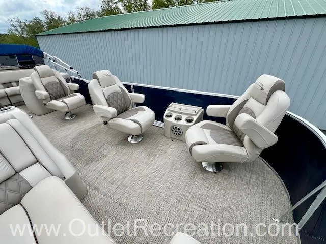 Slide: The Image of 2017 Bennington 23 RSR pontoon boat interior with plush seating and cup holders. - 22