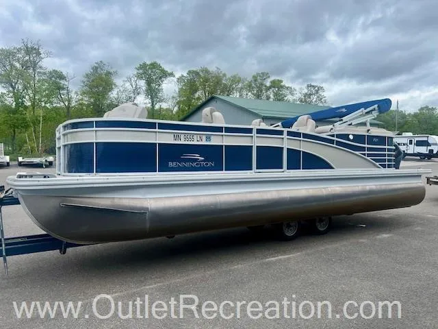 Slide: The Image of 2017 Bennington 23 RSR pontoon boat on trailer, parked outdoors. - 4