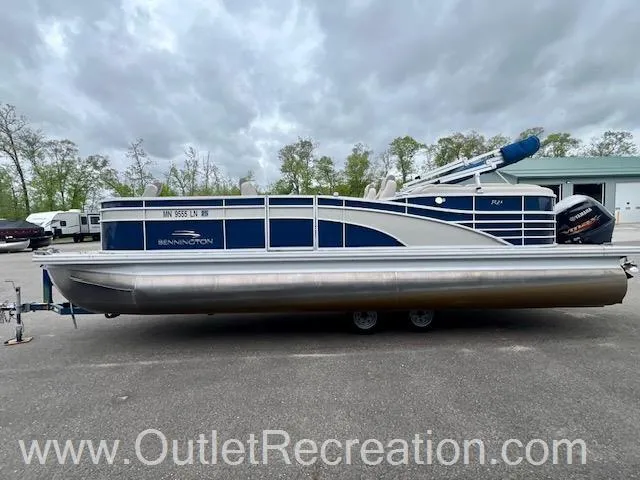 Slide: The Image of 2017 Bennington 23 RSR pontoon boat on trailer, parked outdoors. - 5
