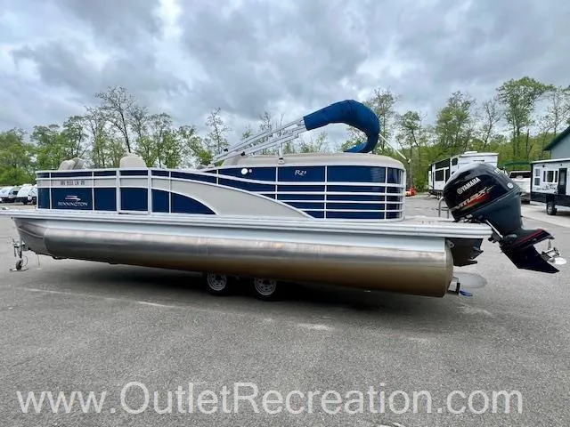 Slide: The Image of 2017 Bennington 23 RSR pontoon boat with Yamaha outboard motor, parked outdoors. - 7