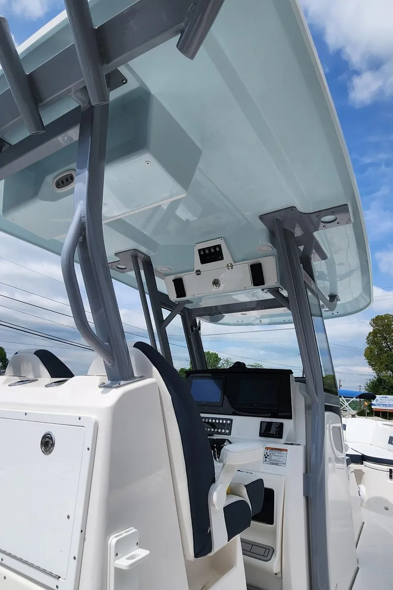 Slide: The Image of 2025 Sea Fox 288 Commander boat helm with modern controls and seating. - 10