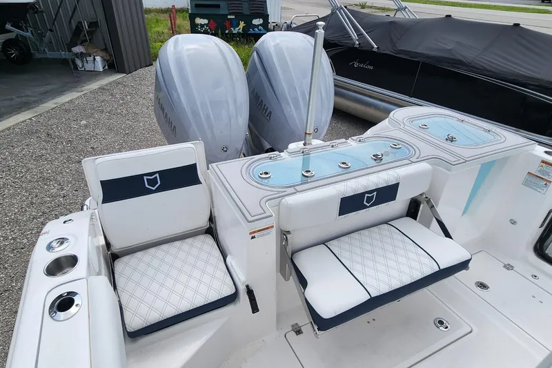 Slide: The Image of 2025 Sea Fox 288 Commander boat with dual engines and cushioned seating. - 12