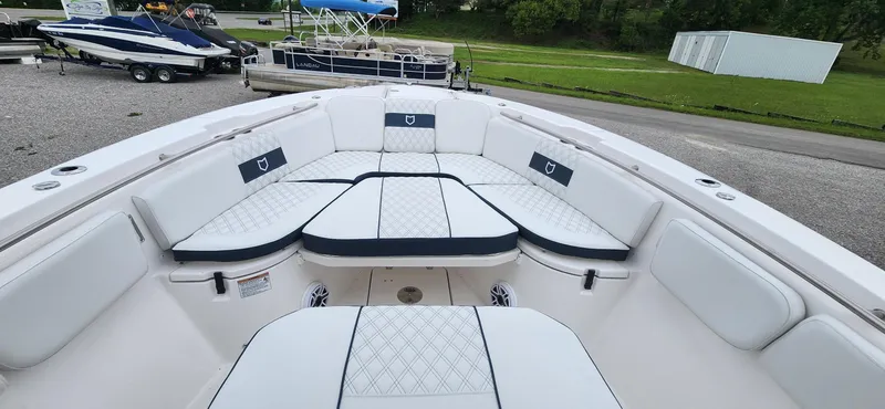 Slide: The Image of 2025 Sea Fox 288 Commander boat interior with cushioned seating and sleek design. - 15