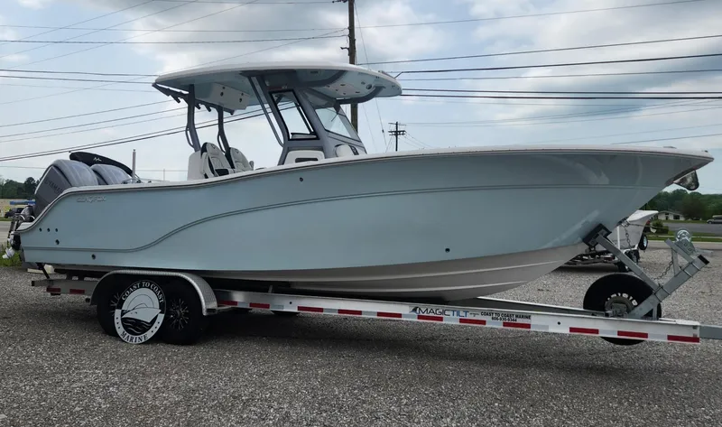 Slide: The Image of 2025 Sea Fox 288 Commander boat on trailer, side view, outdoors. - 2