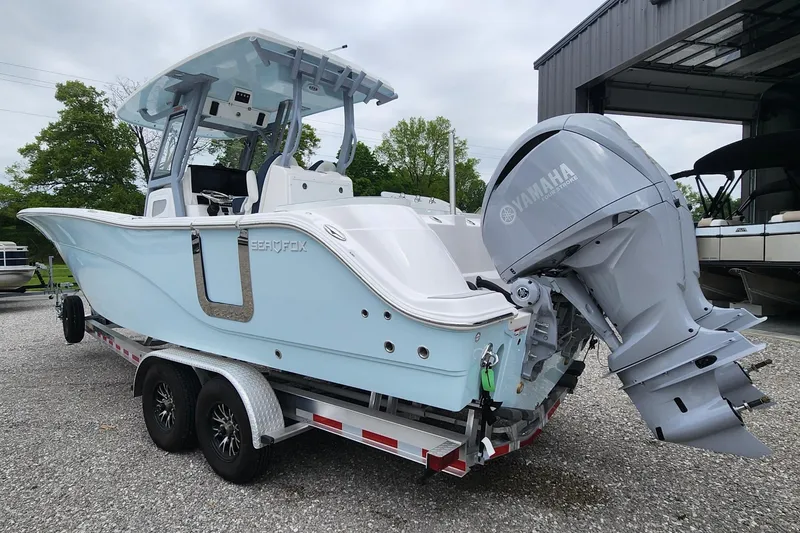 Slide: The Image of 2025 Sea Fox 288 Commander boat on trailer with Yamaha engine, parked outdoors. - 4