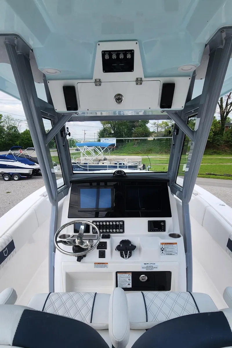 Slide: The Image of 2025 Sea Fox 288 Commander boat cockpit with modern controls and navigation system. - 8