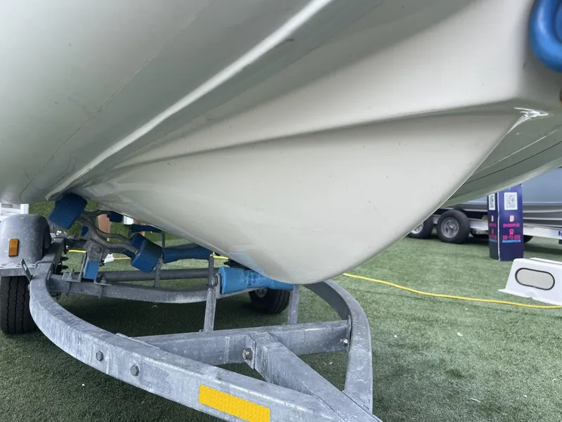 Slide: The Image of Close-up of 2021 Apex A12 boat hull on trailer. - 14