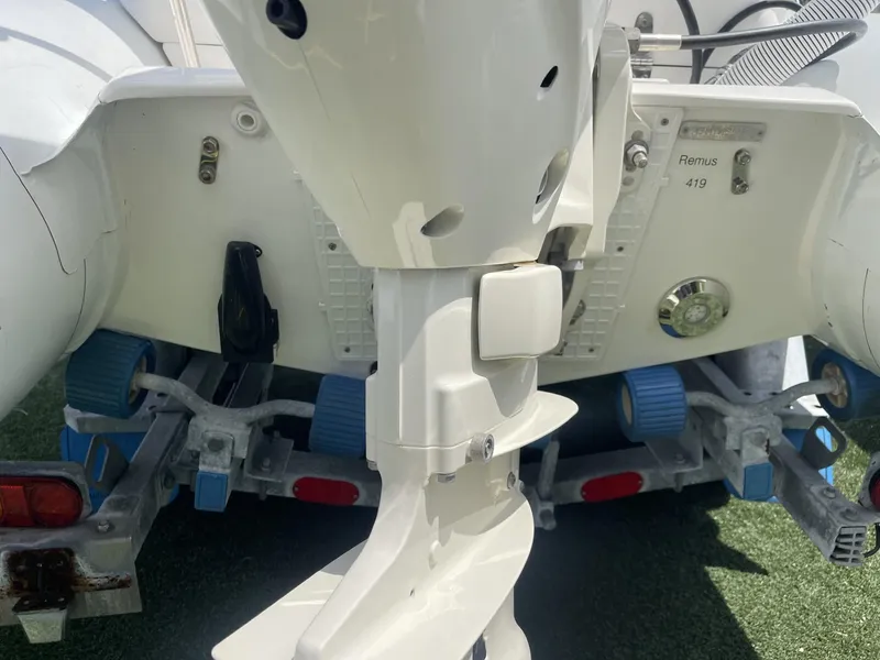 Slide: The Image of Apex A12 2021 boat motor and trailer with blue rollers. - 5