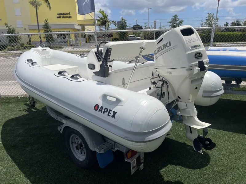 Slide: The Image of Apex A12 inflatable boat with Suzuki outboard motor on a trailer, 2021 model. - 8