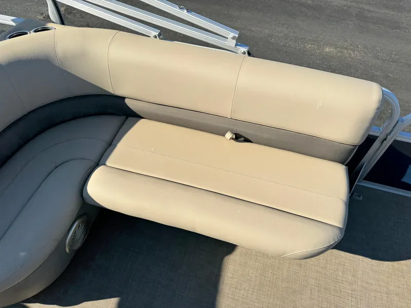 Slide: The Image of 2023 Sun Tracker Bass Buggy 18 DLX beige seating area on a pontoon boat. - 15