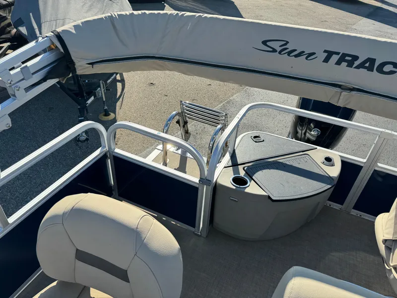 Slide: The Image of 2023 Sun Tracker Bass Buggy 18 DLX pontoon boat interior with seating and storage. - 16