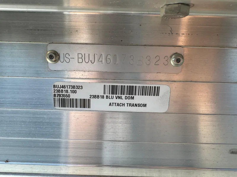 Slide: The Image of 2023 Sun Tracker Bass Buggy 18 DLX hull identification number and barcode on metal surface. - 3