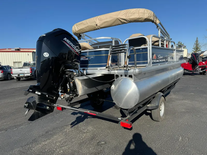 Slide: The Image of 2023 Sun Tracker Bass Buggy 18 DLX pontoon boat with Mercury outboard motor. - 4