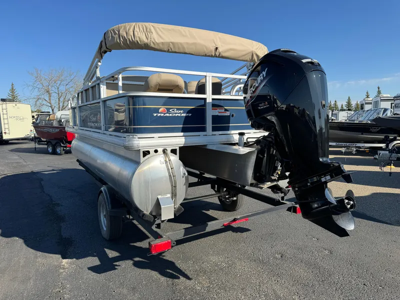 Slide: The Image of 2023 Sun Tracker Bass Buggy 18 DLX pontoon boat with Mercury outboard motor. - 5