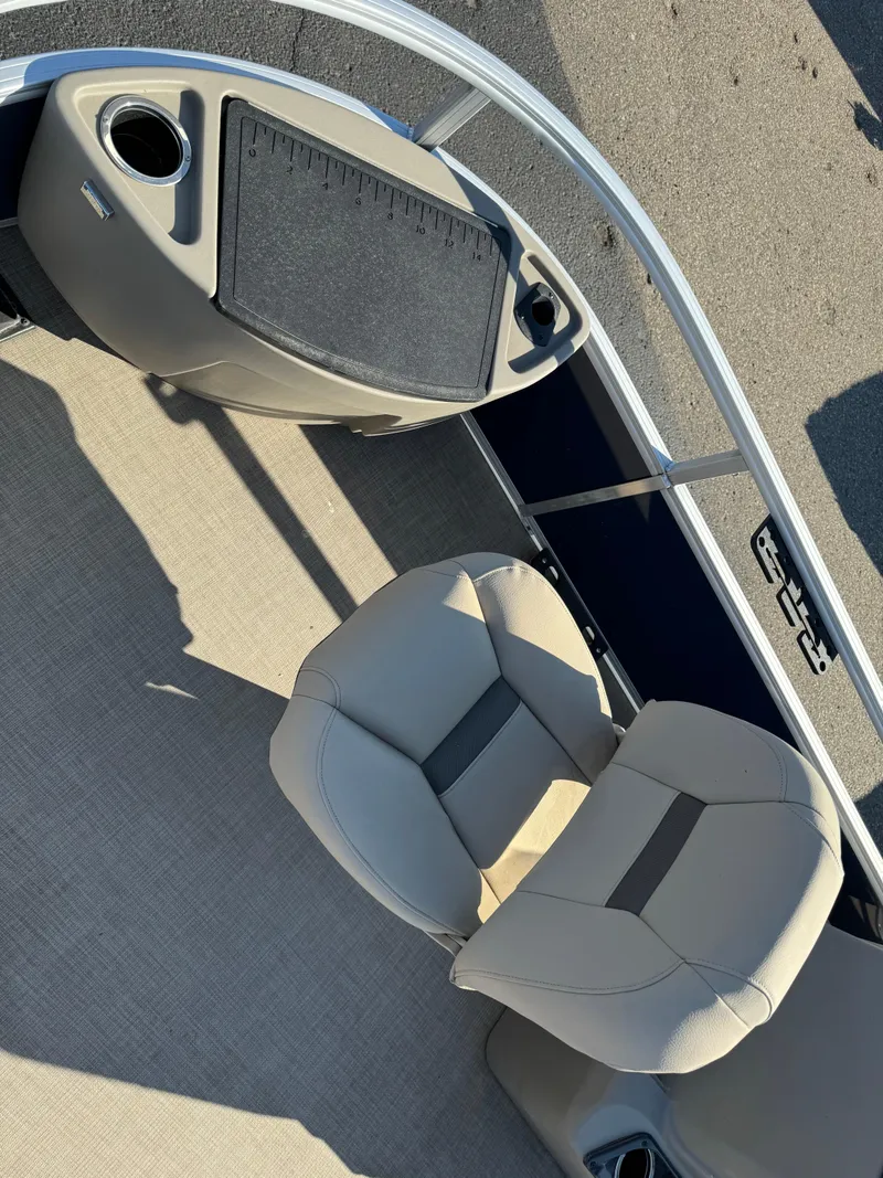 Slide: The Image of 2023 Sun Tracker Bass Buggy 18 DLX boat interior with seating and console. - 6