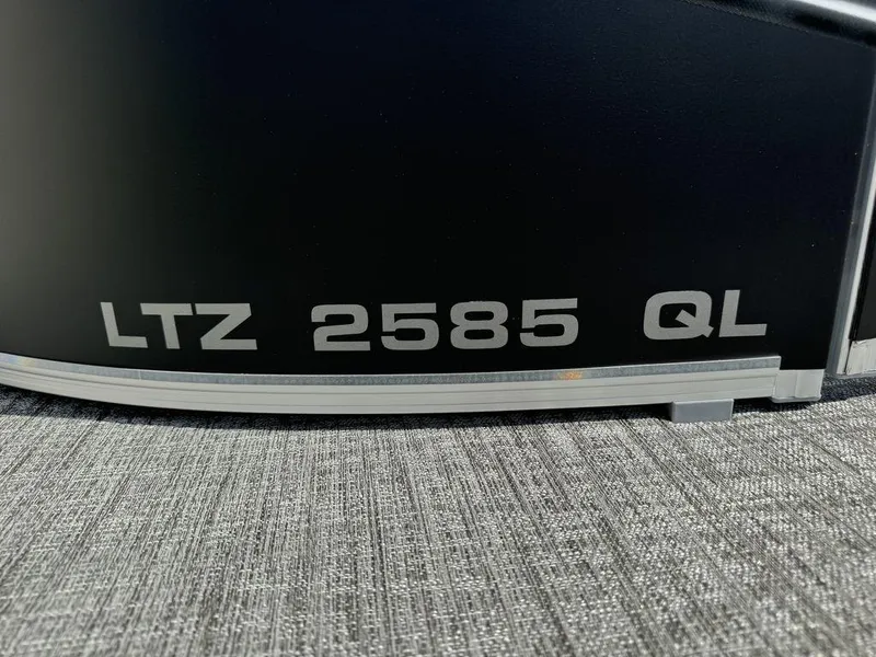 Slide: The Image of 2025 Tahoe LTZ 2585 QL model nameplate on a textured surface. - 14