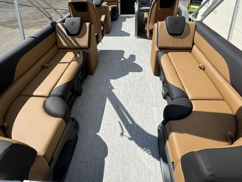 Slide: The Image of 2025 Tahoe LTZ 2585 QL pontoon boat interior with tan and black seating. - 5