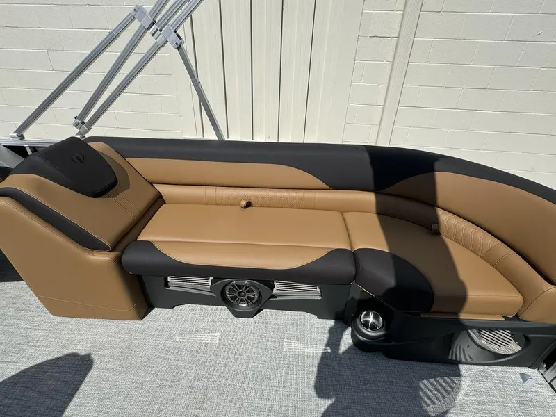 Slide: The Image of 2025 Tahoe LTZ 2585 QL boat interior with tan and black seating. - 6
