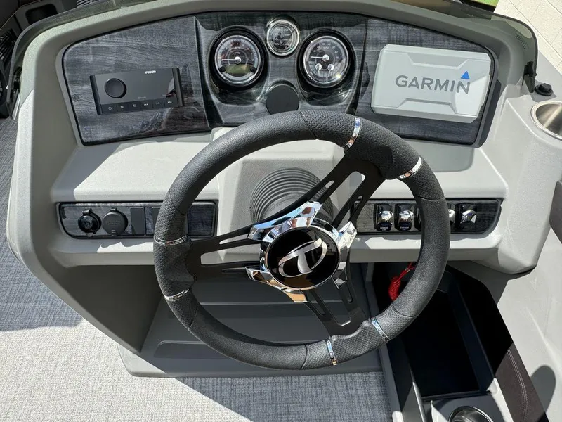 Slide: The Image of 2025 Tahoe LTZ 2585 QL boat dashboard with Garmin navigation and Fusion audio system. - 9