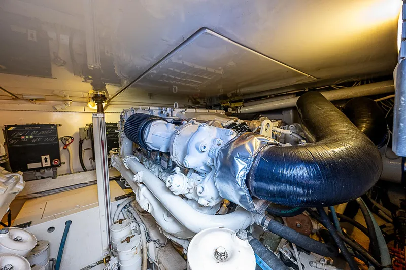 Slide: The Image of Engine room of 2005 Bertram 450 Convertible yacht, showcasing machinery and components. - 26