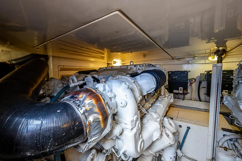 Slide: The Image of Engine room of 2005 Bertram 450 Convertible yacht, showcasing machinery and components. - 27