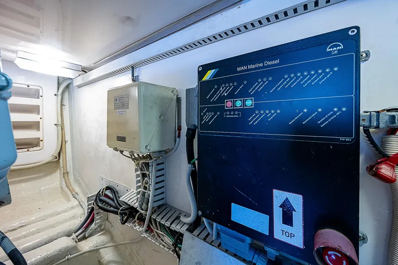 Slide: The Image of Engine room of 2005 Bertram 450 Convertible with control panel and wiring. - 32