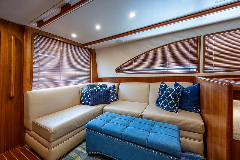 Slide: The Image of Luxurious interior of 2005 Bertram 450 Convertible yacht with plush seating and blue accents. - 45