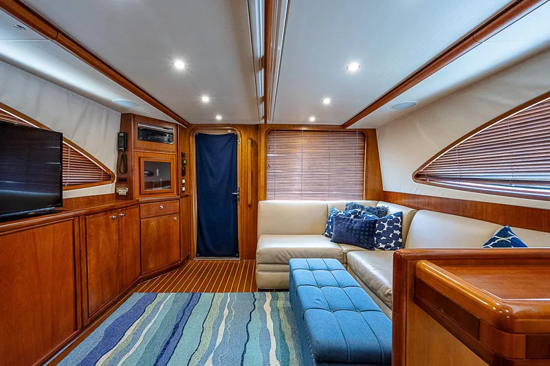 Slide: The Image of Luxurious interior of 2005 Bertram 450 Convertible yacht with plush seating and elegant wood finishes. - 46