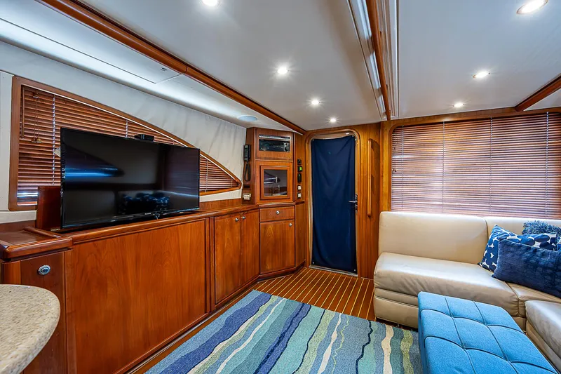Slide: The Image of Luxurious interior of 2005 Bertram 450 Convertible yacht with wood paneling and modern amenities. - 47