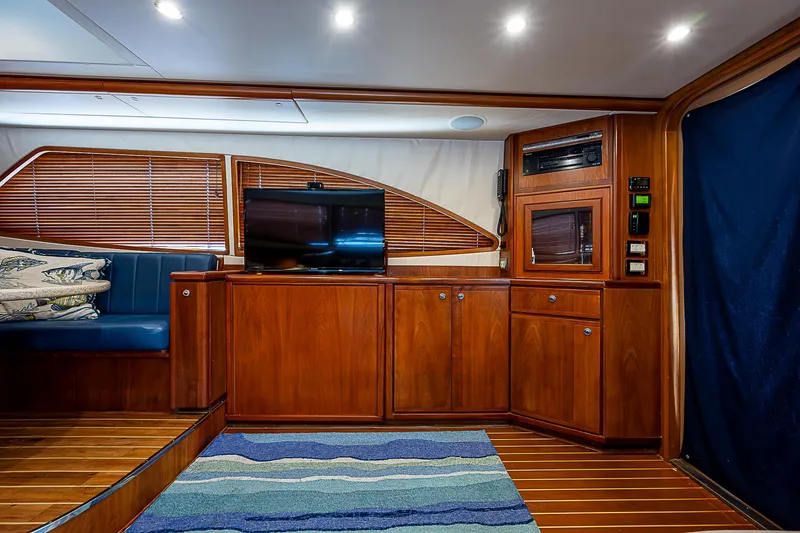 Slide: The Image of Interior of 2005 Bertram 450 Convertible yacht with wood paneling and modern amenities. - 48