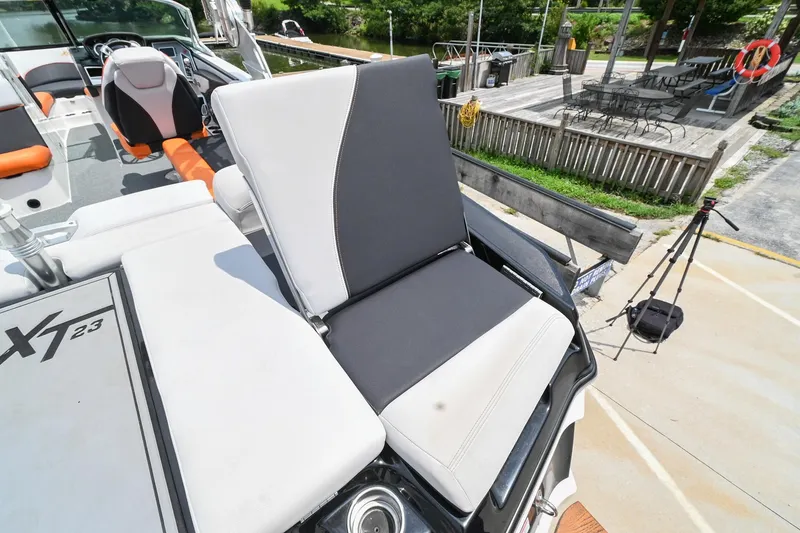 Slide: The Image of 2018 MasterCraft XT23 boat with adjustable seating and modern design. - 13