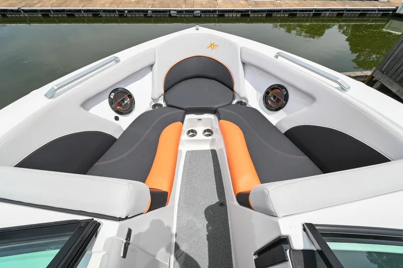Slide: The Image of 2018 MasterCraft XT23 boat interior with stylish seating and speakers. - 37