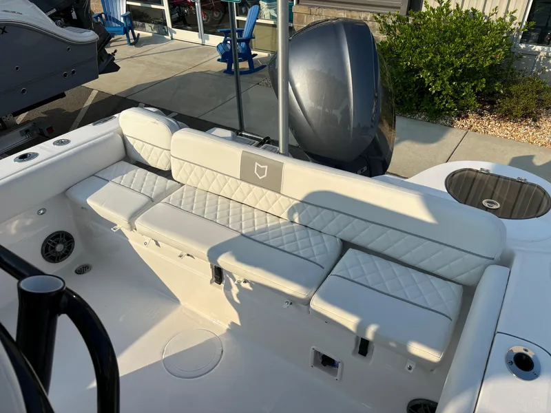 Slide: The Image of 2025 Sea Fox 248 Side Console boat with cushioned seating and modern design. - 12