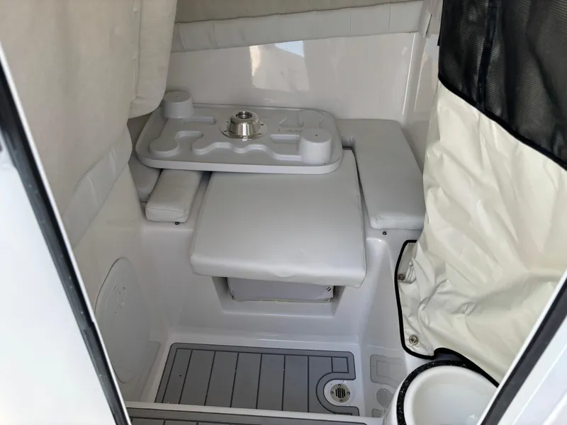 Slide: The Image of 2025 Sea Fox 248 Side Console interior cabin with seating and storage. - 13