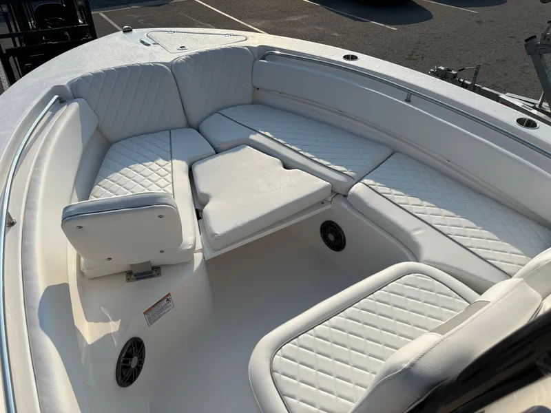 Slide: The Image of 2025 Sea Fox 248 Side Console boat with white cushioned seating and sleek design. - 14