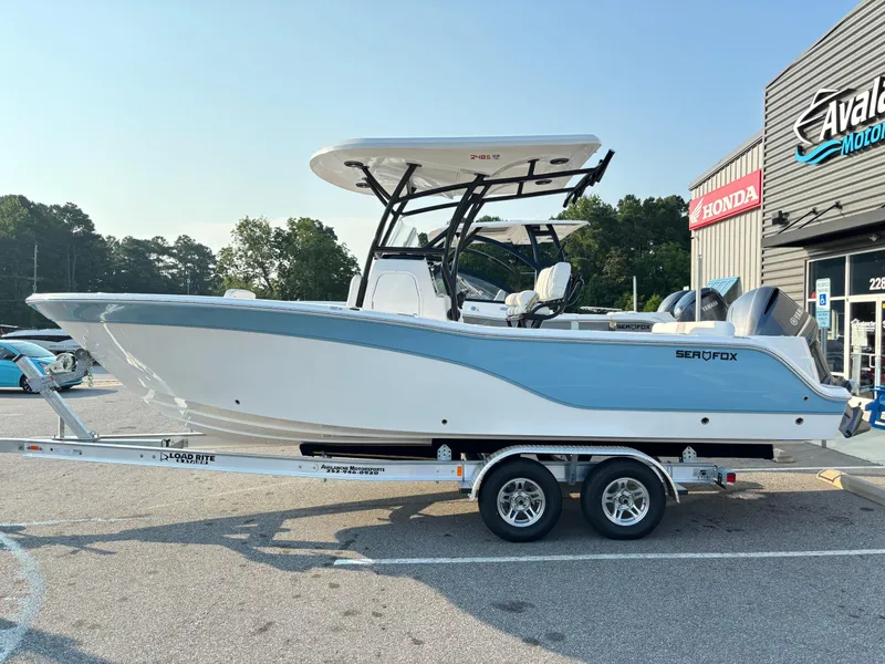 Slide: The Image of 2025 Sea Fox 248 Side Console boat on trailer, parked outside dealership. - 4