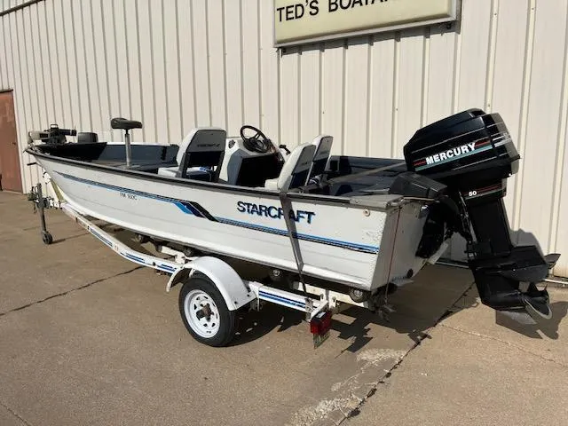 Slide: The Image of 1992 Starcraft FM 160C boat with Mercury outboard motor on trailer. - 1