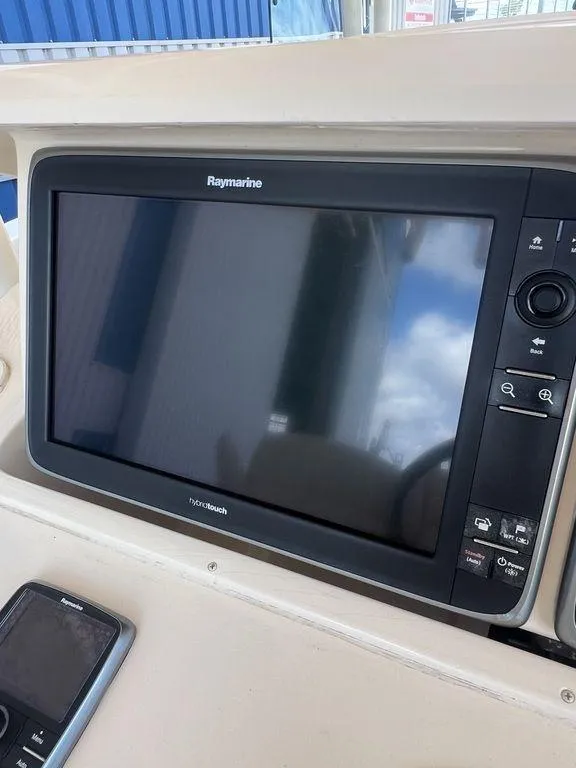 Slide: The Image of Raymarine navigation display on 2012 Grady-White 336 Canyon boat dashboard. - 12
