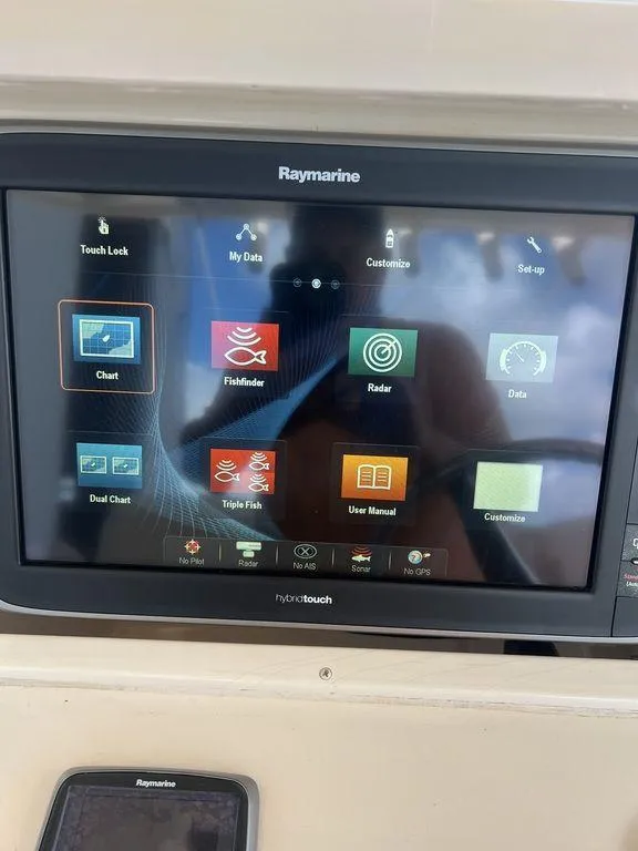 Slide: The Image of Raymarine display on 2012 Grady-White 336 Canyon boat, showing navigation and fishing apps. - 15