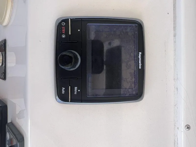 Slide: The Image of Raymarine control panel on 2012 Grady-White 336 Canyon boat dashboard. - 17