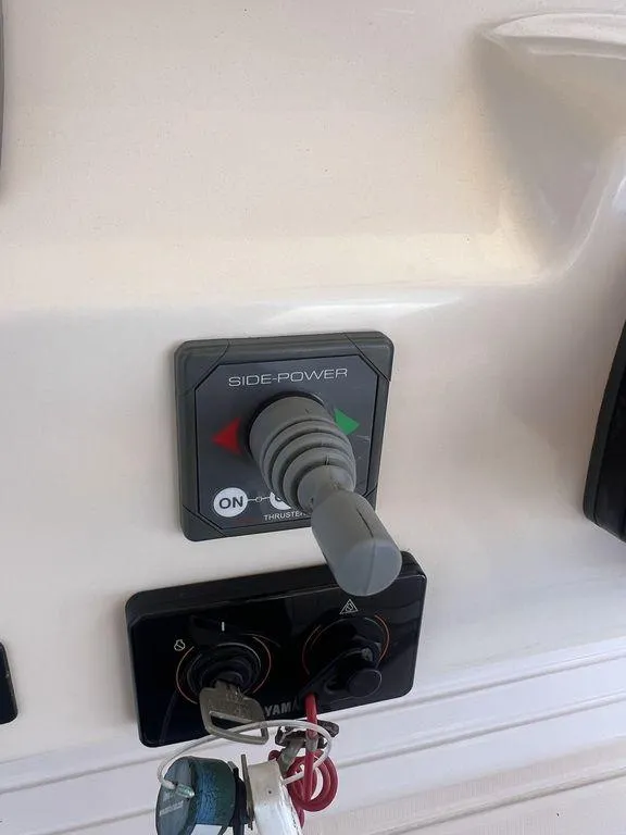 Slide: The Image of 2012 Grady-White 336 Canyon boat controls with Side-Power joystick and Yamaha ignition keys. - 19