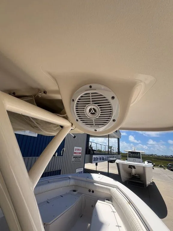 Slide: The Image of 2012 Grady-White 336 Canyon boat interior with speaker, showcasing sleek design and spacious seating. - 29