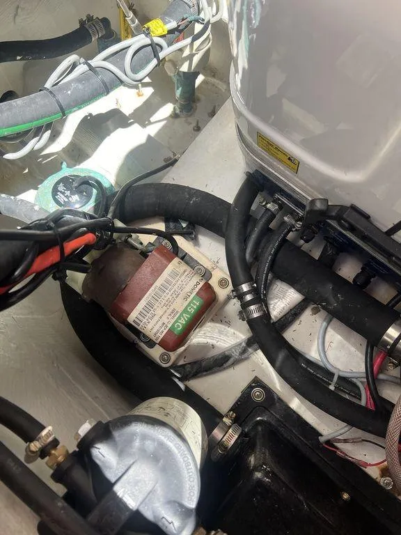 Slide: The Image of Engine compartment of a 2012 Grady-White 336 Canyon boat, showing wiring and components. - 44