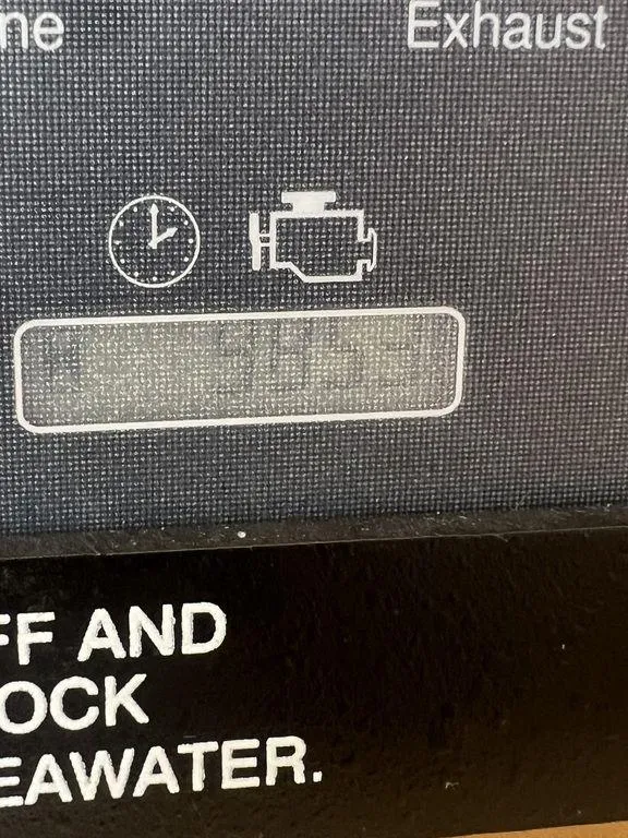 Slide: The Image of Close-up of a 2012 Grady-White 336 Canyon engine display panel. - 47