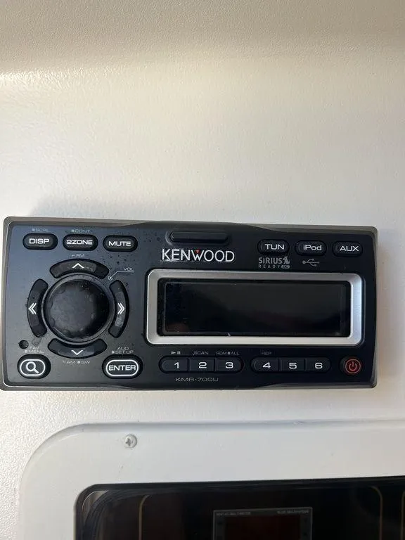 Slide: The Image of Kenwood audio system on 2012 Grady-White 336 Canyon boat dashboard. - 49