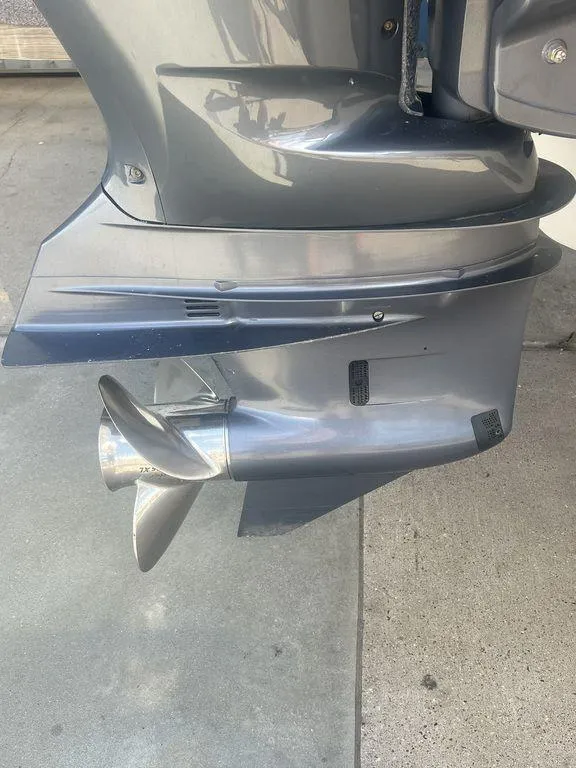 Slide: The Image of 2012 Grady-White 336 Canyon boat motor with propeller, close-up view. - 5