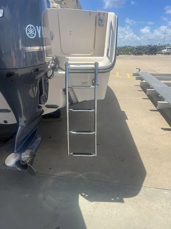 Slide: The Image of 2012 Grady-White 336 Canyon boat with Yamaha engine and boarding ladder. - 8